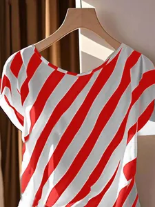 Detail view of red and white diagonal striped plus size top with round neck