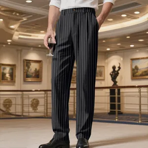 Model wearing black pinstripe straight-leg trousers in a formal ballroom setting