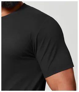 Close-up detail view of the black quick-dry men's athletic t-shirt sleeve and fabric texture