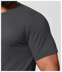 Detail view of dark gray quick-dry athletic T-shirt showing fabric texture and fit