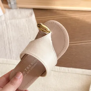 Beige children's toe-clip sandals with gold buckle detail for summer beach wear