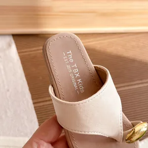 Stylish cream leather summer thong sandals with metallic gold detail and comfortable thick sole