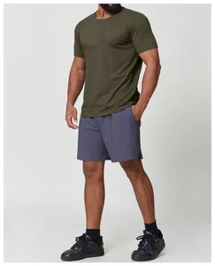 Detailed view of men's olive green quick-dry athletic t-shirt and athletic shorts
