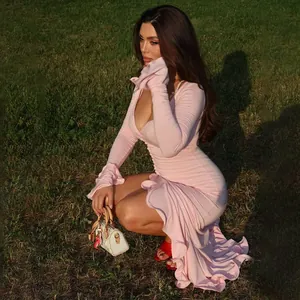 Elegant slim fit pink V-neck long sleeve dress with ruffles and a stylish side split