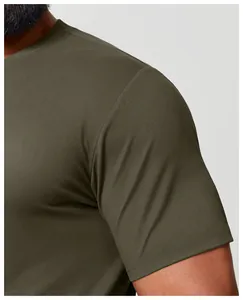 Close-up of olive green quick-dry crew neck t-shirt showing fabric texture and shoulder seam