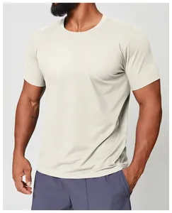 Close-up detail of men's cream quick-dry crew neck athletic t-shirt on a fit model