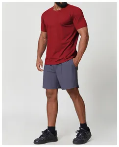 Macro view of men's crew neck quick-dry athletic t-shirt in deep red for hiking