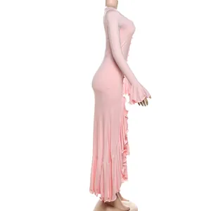 Side view of a slim pink long-sleeved dress with elegant ruffle details and side slit