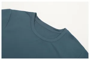Macro view of the high-quality stitching on a men's athletic crew neck t-shirt.