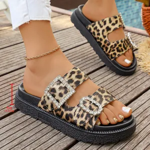 Close-up of leopard print platform sandals with rhinestone buckles and 4cm heel.