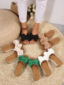 Stylish women's platform sandals with large decorative bows in multiple color options