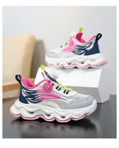 Detail view of breathable girls' mesh sneakers with wavy soles and pink accents.