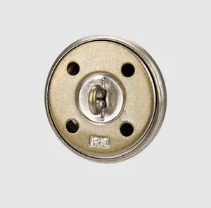 Detailed macro view of the brass button back with embossed IRIS branding