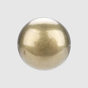 Close-up macro view of a high-grade Japanese brass button with a domed metallic finish