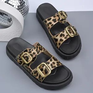 Trendy leopard print platform sandals with gold buckles on a stylish grey background
