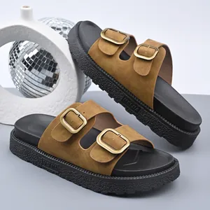 Close-up of stylish brown platform sandals with adjustable double buckle straps.