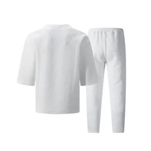 Back view of men's white jacquard casual set featuring textured fabric and relaxed fit
