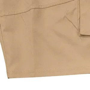 Close-up macro view of durable khaki twill fabric and double-stitched seams on cargo shorts