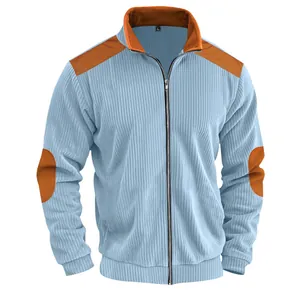 Macro detail showing heavy corduroy texture on light blue men's retro zip-up jacket