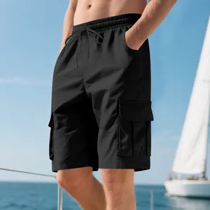 Close-up side view of men's black cargo shorts with multi-pockets in summer outdoor