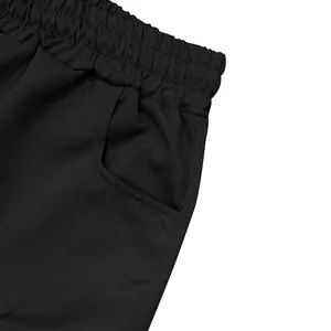 Detailed macro shot of black elastic waistband and pocket on men's cargo shorts