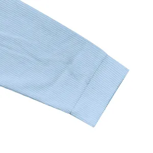 Macro detail shot showing the ribbed cuff texture of a light blue casual men's jacket