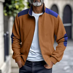 Detailed view of men's retro heavy velvet jacket with contrast blue shoulder patches.