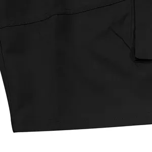Close-up detail of black cargo shorts showing high-quality fabric texture and stitching