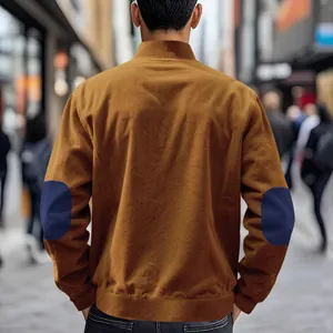 Back view showcasing the corduroy texture and navy blue elbow patches on a brown jacket