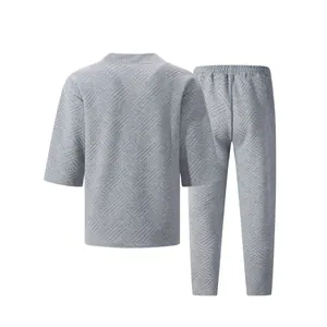 Detailed view of grey textured jacquard short sleeve and long pants set for men's leisure