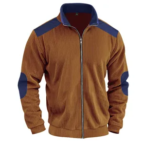 Detail of brown corduroy mens jacket with navy blue color-blocked patches and zipper