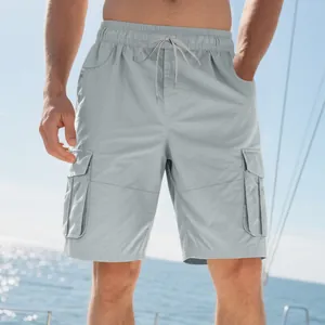 Detailed view of men's light grey cargo shorts with functional pockets and drawstring