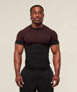 Front view of a muscular model in a black and red compression fit gym t-shirt for training