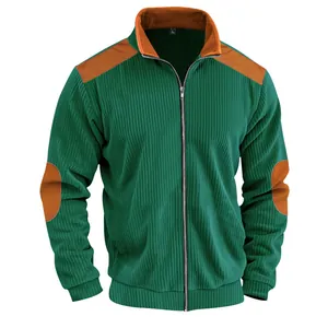 Close-up of men's vintage green corduroy jacket with brown shoulder and elbow patches