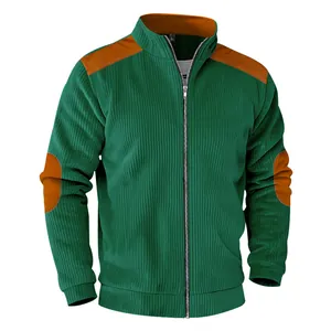 Macro view of men's green corduroy jacket with stylish brown shoulder and elbow patches.