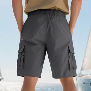 Rear view of men's loose cargo shorts featuring elastic waist and large functional flap pockets