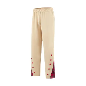 Pantaloni sportivi uomo con coulisse e dettagli bottoni in tartan rosso sul fondo