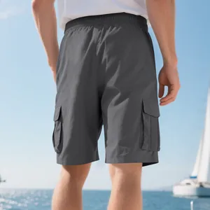 Back view of men's grey cargo shorts with elastic waist and side flap pockets