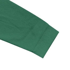 Detailed macro view of dark green ribbed sleeve cuff on heavy cotton fleece jacket