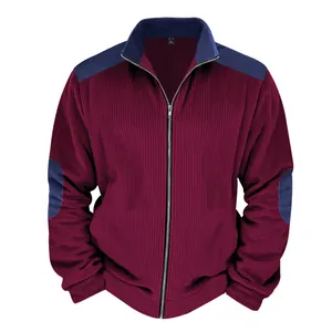 Detailed view of men's burgundy heavy fleece jacket with navy patchwork and mock neck