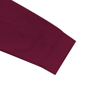 Detailed close-up showing the ribbed cuff and heavy cotton fleece texture of this burgundy jacket