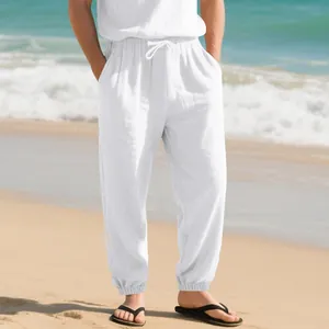 Detailed view of men's breathable white linen joggers featuring drawstring and cuffs
