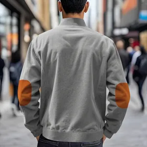 Detailed rear view of a premium grey corduroy jacket with brown elbow patch accents