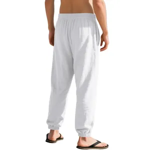 Detailed back view of men's white linen joggers showing casual fit and elastic cuffs