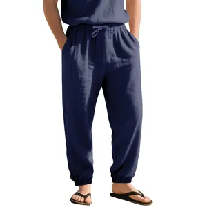 Detailed view of navy blue linen joggers with drawstring waist and elastic cuffs