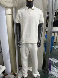 Men's casual textured waffle knit polo shirt and matching trousers set in beige cream