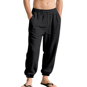 Men's loose black linen casual pants featuring drawstring waist and elastic cuffs.