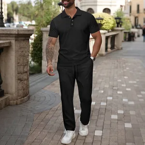 Men's summer leisure set featuring black jacquard polo shirt and trousers