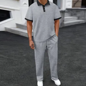 Men's summer casual set featuring grey textured polo shirt and matching long pants