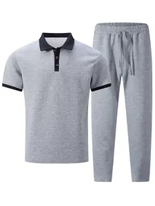 Detailed view of the grey jacquard textured men's polo shirt and drawstring trousers set